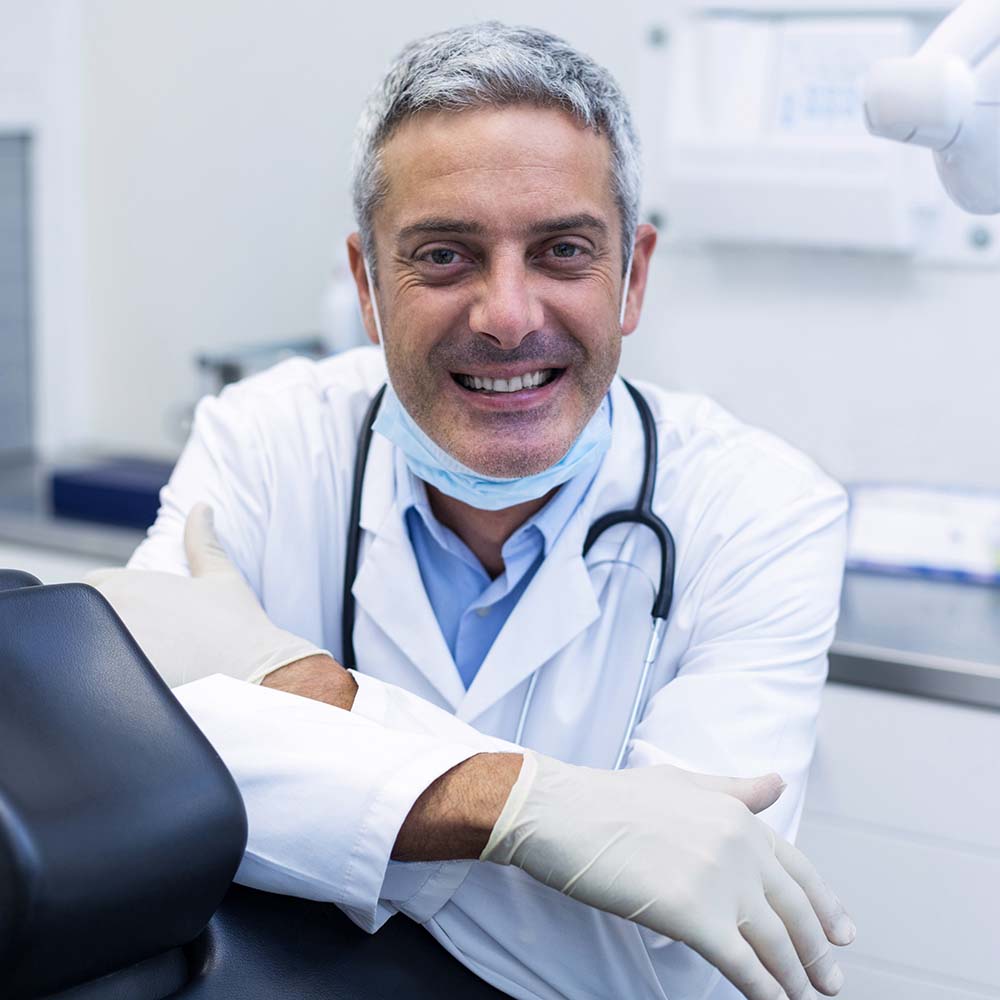 portrait of a smiling dentist ALKGVH